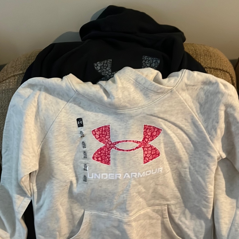 Under Armour hoodies. Girls XL. Cream still has tags on. Black worn once.
